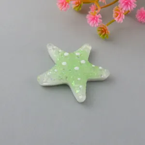Resin starfish flatback charm in gradient green with glitter dots, ideal for hair clips and DIY crafts.