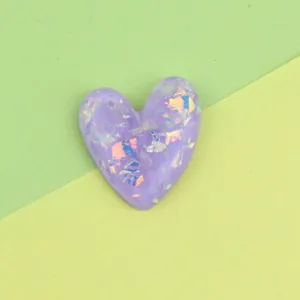 Purple heart resin cabochon with iridescent foil flakes, DIY phone case accessory charm.