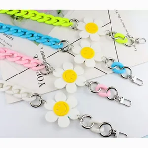 Acrylic chain strap with cute daisy smiley face, colorful cross-body bag accessory.
