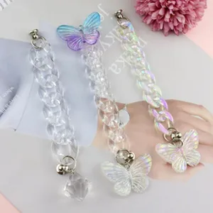 Acrylic bag chain strap detail with butterfly pendant, stylish purse accessory for cross-body.