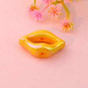 Glossy iridescent lip shaped acrylic loose beads for DIY jewelry making accessories and crafts.