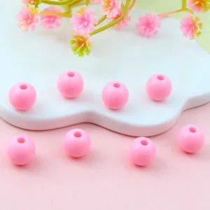 Pink acrylic round beads detail, ideal for DIY jewelry making and beautiful spacer design.