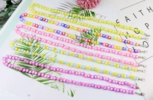 Colorful acrylic heart mask chain and stylish glasses chain with vibrant beads for daily use.