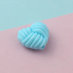 Light blue twisted heart acrylic bead detail shot for DIY phone chains and jewelry accessories.