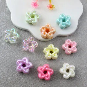 Close-up of colorful hollow pentagram acrylic beads for DIY jewelry and phone charms.
