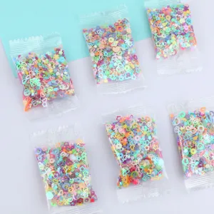 Various holographic mixed shape sequins for DIY crafts and slime filling detail view.