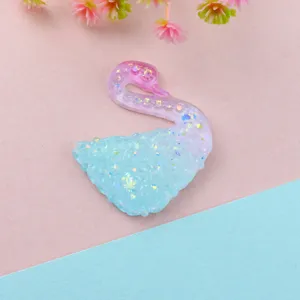 Resin swan cabochon detail, glitter gradient craft piece for DIY phone case, hair clip accessory.