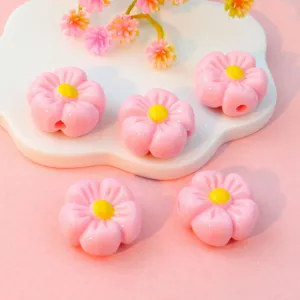 Pink acrylic flower loose beads with yellow center, perfect for DIY phone charms and jewelry accessories.