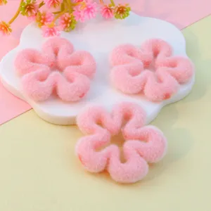 Pink flocked flower loose beads, delicate hollow five-petal design for DIY jewelry making detail.