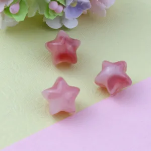 Close-up detail view of pink gradient star acrylic loose beads for handmade jewelry design.