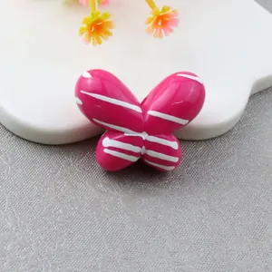 Close-up detail of large striped pink butterfly loose bead, perfect for DIY jewelry and phone chains.