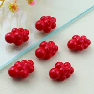 Detailed view of glossy red acrylic cloud shape loose beads, perfect for DIY jewelry making.
