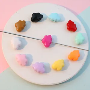 Colorful acrylic cloud beads detail shot, smooth solid surface for DIY jewelry making.