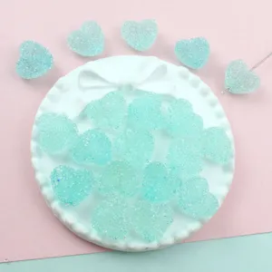 Light blue sugar heart acrylic beads, close-up view of DIY jewelry making accessories.