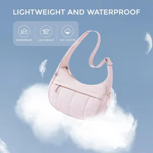 Lightweight and waterproof quilted shoulder bag with adjustable strap and fluffy puffer design.