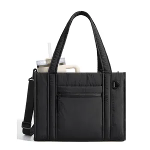 Black quilted tote bag with shoulder strap, large capacity casual handbag for commuter daily use.