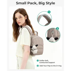 Mini quilted puffer backpack featuring a soft contoured design and convenient D-ring attachment.