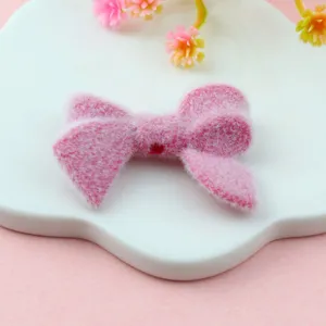 Pink flocked bow bead, soft DIY crafting charm for handmade jewelry making and accessories.