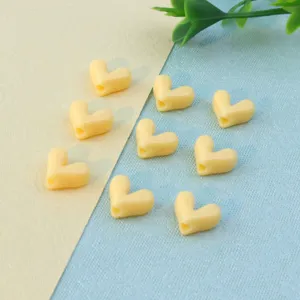 Yellow heart-shaped loose beads detail shot, ideal for DIY handmade bracelets necklaces.