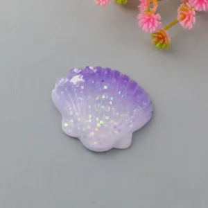 Macaron gradient seashell resin charm, shimmering holographic glitter DIY craft accessory.
