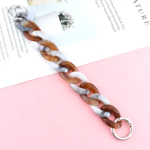 Acrylic chain strap with tortoise shell and marble grey design, stylish phone accessory detail.