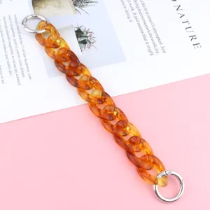 Stylish acrylic amber chain strap for phone case or bag decoration, durable and trendy accessory.