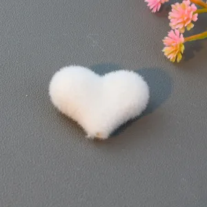 White flocked heart shaped loose bead craft accessory for DIY jewelry making detail view.