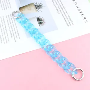 Blue acrylic chain strap for phone or bag, translucent marble loop accessory with metal rings.