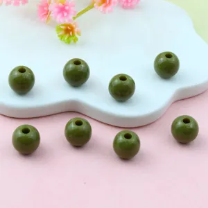 Olive green acrylic round beads detail close up, perfect for DIY jewelry crafting.