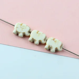 White crackle turquoise elephant beads detail, ideal for DIY jewelry making and spacer design.