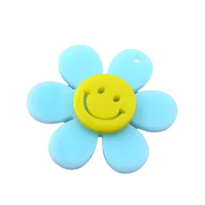 Pendente girasole in acrilico blu con sorriso giallo, ideale per la creazione di gioielli.