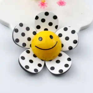 Acrylic polka dot flower patch with yellow smiley face, perfect for DIY craft and accessories.