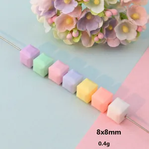Detailed shot of colorful acrylic faceted square beads, 8x8mm spacer bead detail view.