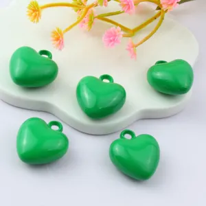 Detailed view of 17mm small green acrylic heart pendant, glossy DIY jewelry accessories.
