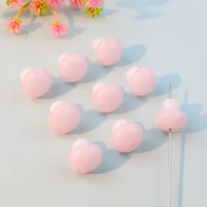 Close-up detail view of pink acrylic 3D mushroom beads, ideal for DIY jewelry making and crafting.