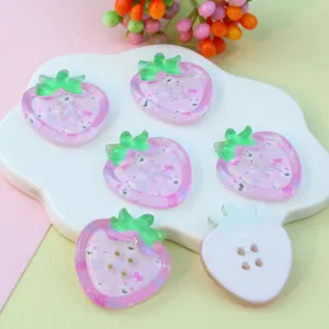 Pink strawberry acrylic buttons with cute cartoon prints, perfect for DIY crafts.