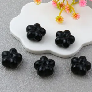 Detailed view of 18mm black acrylic five-petal flower loose beads for jewelry making craft.
