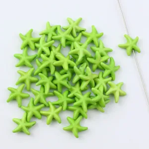 Detail view of green turquoise star shaped loose beads with center drilled hole for DIY jewelry.