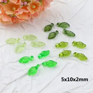 Green acrylic leaf beads close-up detail showing exquisite texture for DIY crafts.