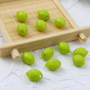 Green lemon shape acrylic beads for DIY jewelry making, bracelets, and phone charms.