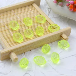 Translucent lemon leaf acrylic beads in fluorescent yellow for DIY bracelets and charms.