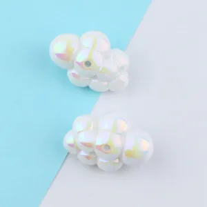 Detailed view of iridescent acrylic cloud beads, colorful DIY jewelry making loose spacer charms.