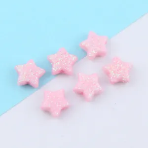 Detail shot of pink glitter star loose beads, perfect for DIY jewelry making and craft projects.