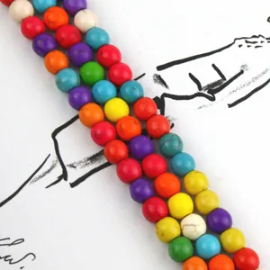 Colorful turquoise stone beads detail shot, smooth round loose beads for DIY jewelry making and crafting.