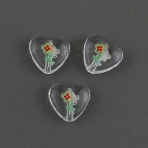 Transparent acrylic heart beads detail view, 15mm floral printed charm for DIY jewelry making.
