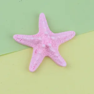 Close-up view of a cute pink resin starfish accessory, showing detailed texture for DIY crafts.