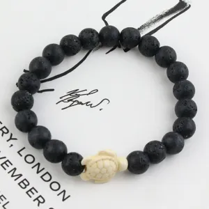 Volcanic stone beaded bracelet with cute turtle charm elastic natural stone jewelry for women detail view