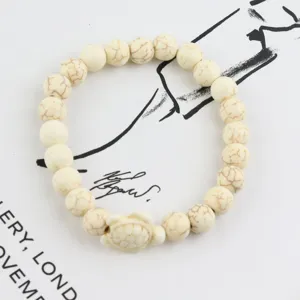 White turquoise beaded bracelet with cute turtle charm, natural stone stretch jewelry.
