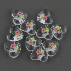 Transparent acrylic heart beads with floral print for DIY jewelry making, necklaces, and bracelets.