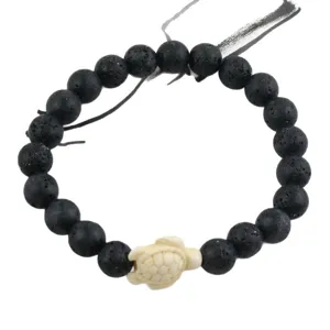 Black lava stone beaded stretch bracelet with white sea turtle charm for women daily wear main